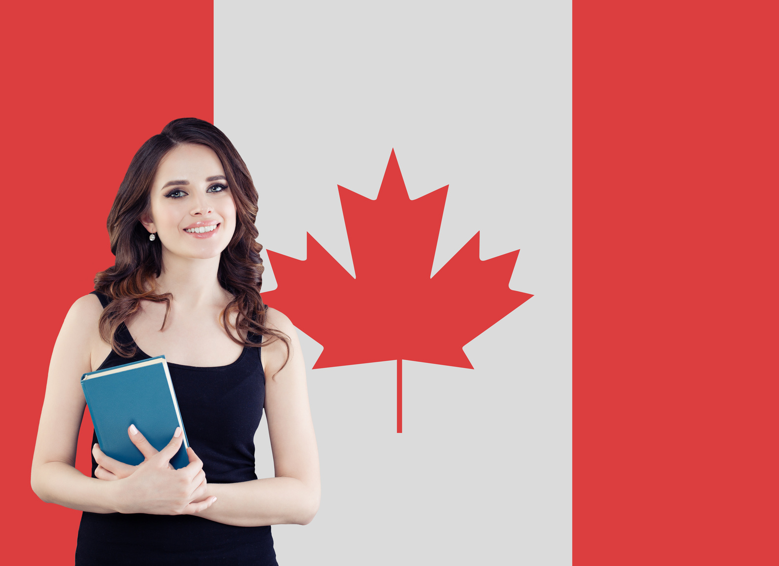 Canada concept. Young woman student with the Canada flag. Live, work, education and internship in Canada